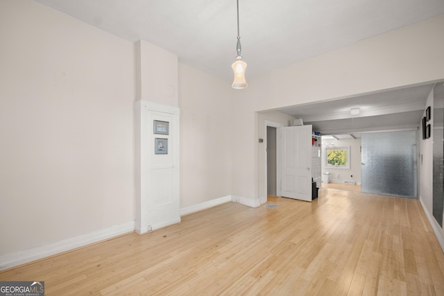 spare room with light wood-type flooring