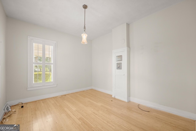 unfurnished room featuring wood-type flooring