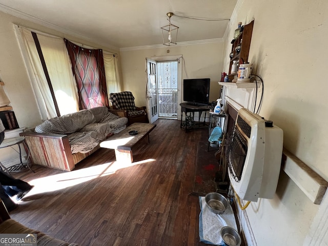 living room with hardwood / wood-style floors, crown molding, and heating unit