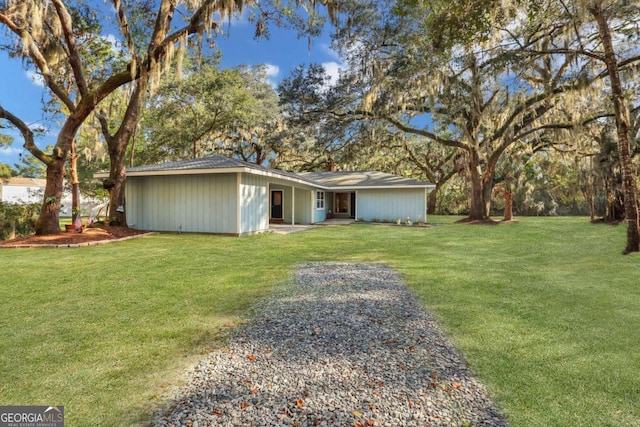 ranch-style house with a front lawn