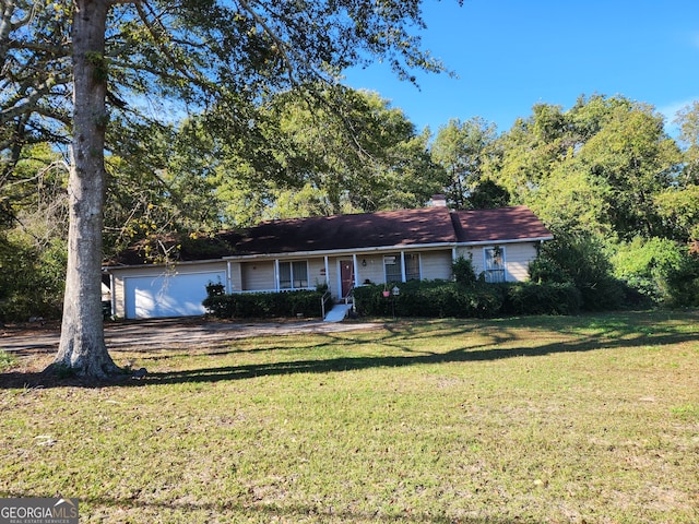 ranch-style home with a front yard, a porch, and a garage