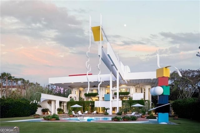 playground at dusk with a lawn