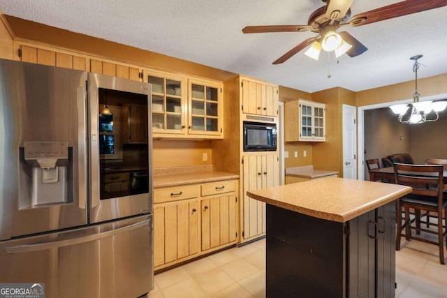 kitchen with a textured ceiling, decorative light fixtures, stainless steel fridge with ice dispenser, and black microwave