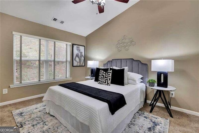 carpeted bedroom featuring ceiling fan and vaulted ceiling