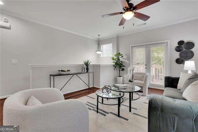 living room with french doors, light wood-type flooring, ceiling fan, and ornamental molding