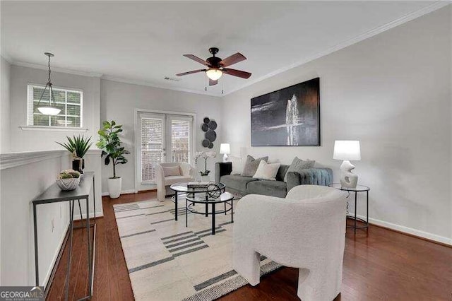 living room with crown molding, hardwood / wood-style floors, and ceiling fan