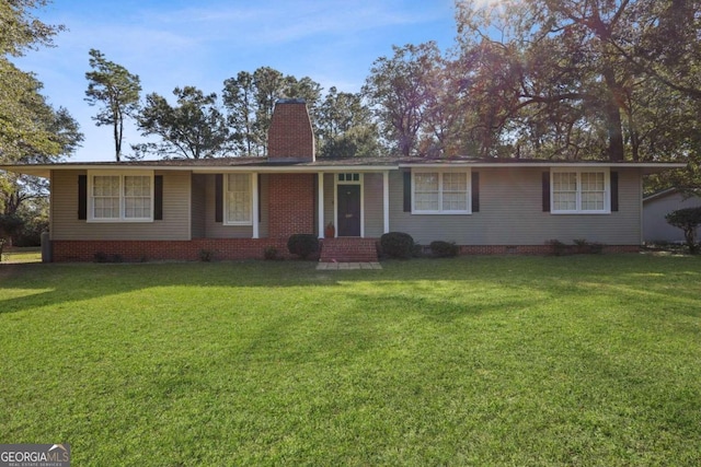 ranch-style house featuring a front yard