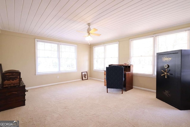 sitting room featuring ceiling fan, wooden ceiling, and light carpet