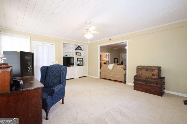 carpeted office space featuring ceiling fan and wooden ceiling