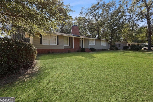 ranch-style house with a front yard