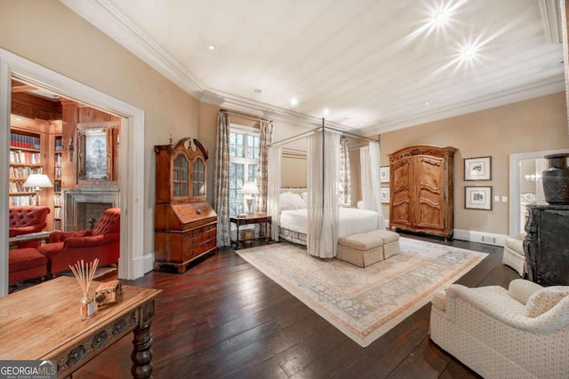 bedroom with dark hardwood / wood-style floors and crown molding