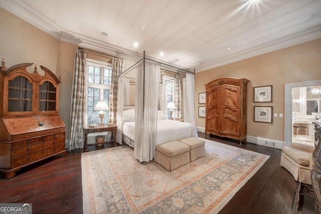 bedroom with dark hardwood / wood-style flooring, crown molding, and an inviting chandelier