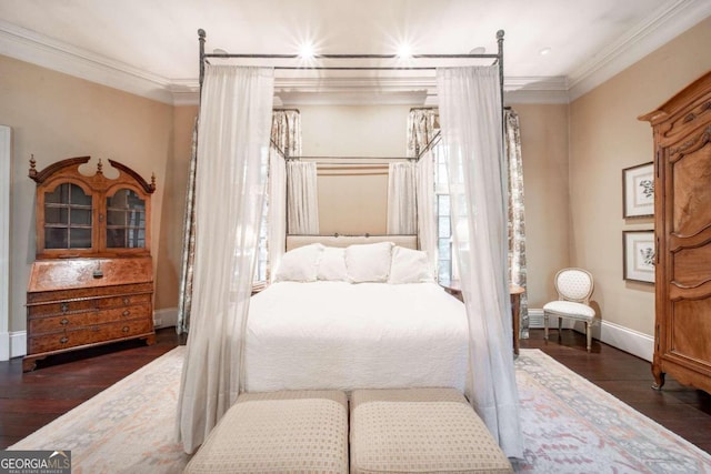 bedroom with crown molding and dark hardwood / wood-style flooring