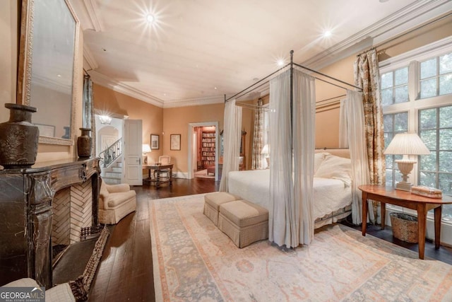 bedroom featuring hardwood / wood-style floors and ornamental molding