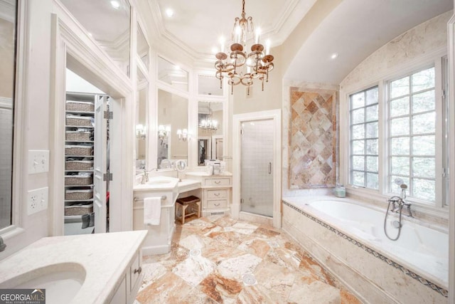 bathroom featuring a notable chandelier, separate shower and tub, and crown molding