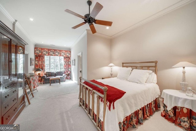 carpeted bedroom with ceiling fan and ornamental molding