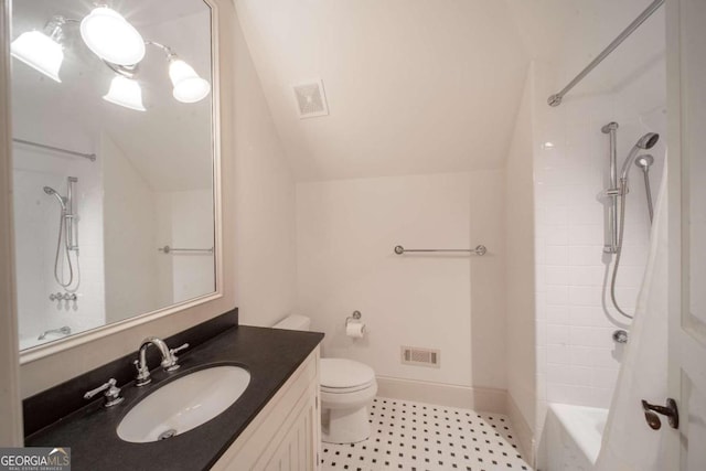 full bathroom with vanity, toilet, lofted ceiling, and shower / tub combo