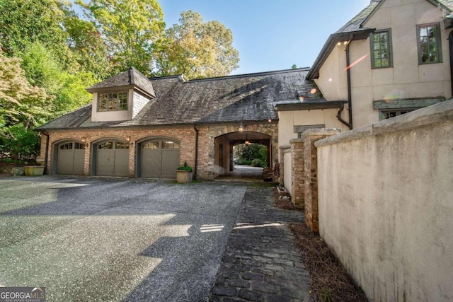 view of side of home with a garage