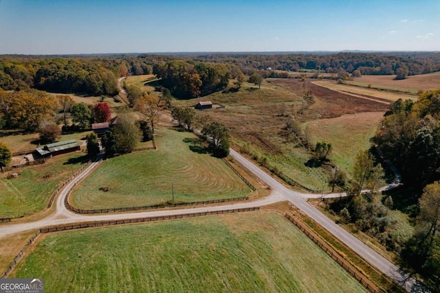 birds eye view of property with a rural view