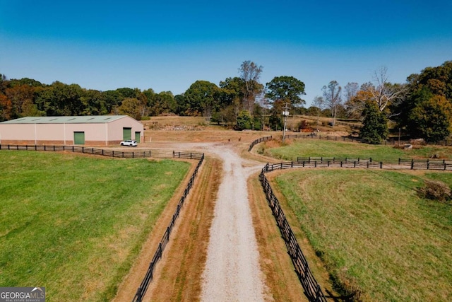 birds eye view of property featuring a rural view