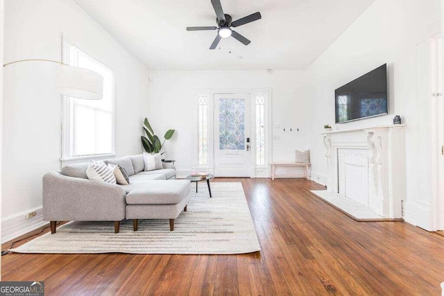 living room featuring hardwood / wood-style flooring and ceiling fan