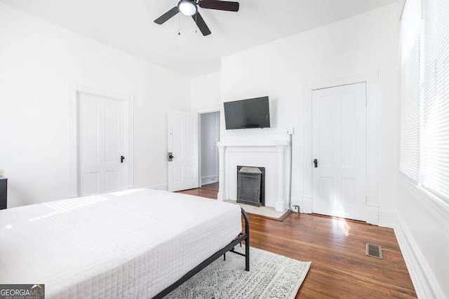 bedroom featuring ceiling fan and dark hardwood / wood-style floors