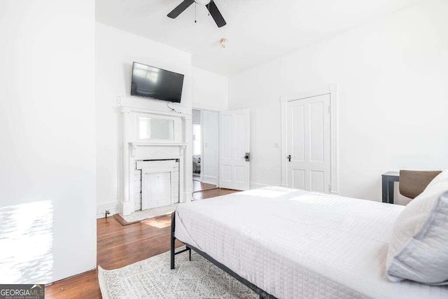 bedroom with hardwood / wood-style flooring and ceiling fan