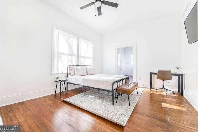 bedroom featuring ceiling fan and hardwood / wood-style flooring