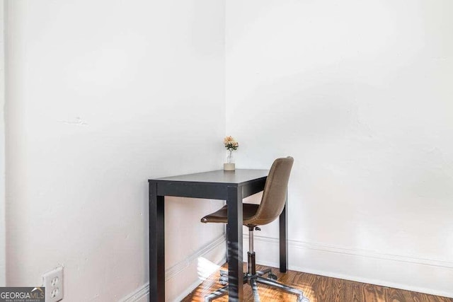 home office with wood-type flooring