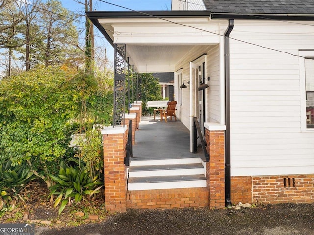 view of property exterior with covered porch