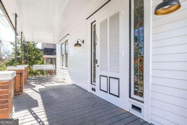 wooden deck featuring a porch