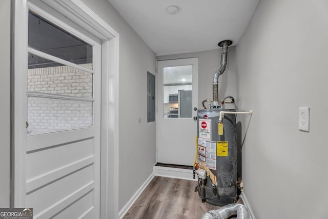 utility room with water heater and electric panel