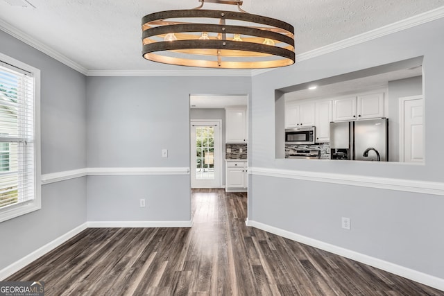 1120 Strath Clyde Way, Mcdonough, GA 30253 - kitchen featuring appliances with stainless steel finishes, white cabinetry, dark wood-style flooring, a textured ceiling, and baseboards