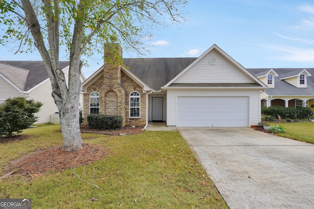 ranch-style house featuring a garage and a front yard