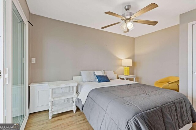 bedroom featuring light hardwood / wood-style floors and ceiling fan