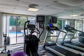 gym featuring a paneled ceiling