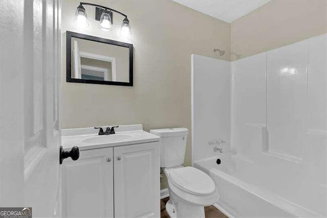 full bathroom featuring vanity, toilet, and bathing tub / shower combination