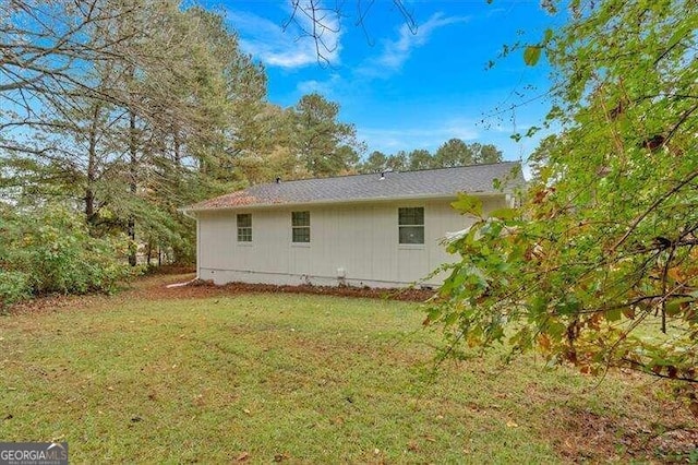 view of property exterior with a lawn