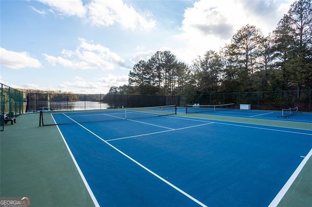 view of sport court with fence