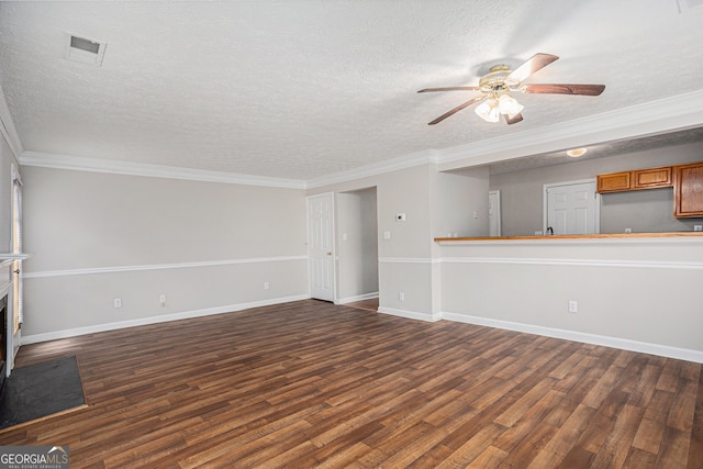 unfurnished living room with a textured ceiling, crown molding, ceiling fan, and dark wood-type flooring