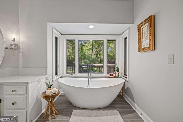 bathroom featuring hardwood / wood-style flooring and a bath