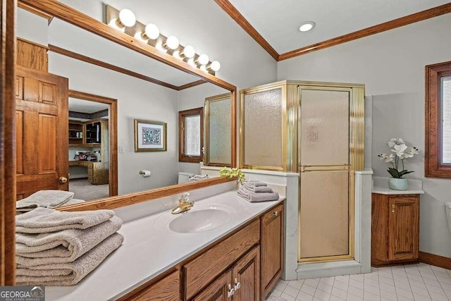 bathroom with vanity, vaulted ceiling, toilet, ornamental molding, and an enclosed shower