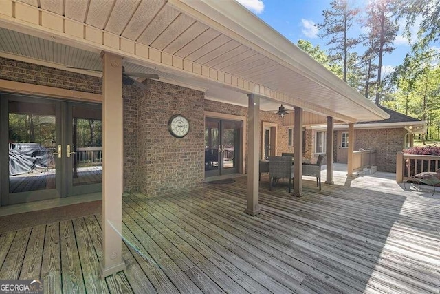 deck with ceiling fan and french doors