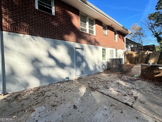 view of side of home featuring cooling unit