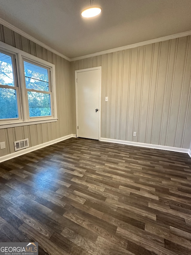 unfurnished room with dark hardwood / wood-style floors and ornamental molding