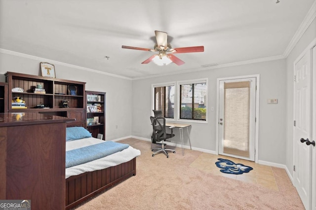 carpeted bedroom with ceiling fan and crown molding