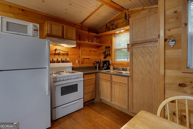 kitchen featuring wood walls, white appliances, sink, vaulted ceiling, and wood ceiling