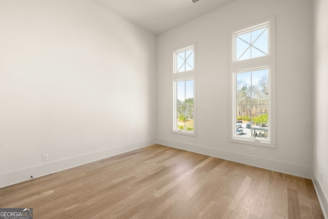 unfurnished room featuring light wood-type flooring