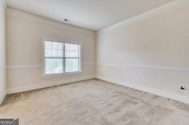 carpeted spare room with crown molding