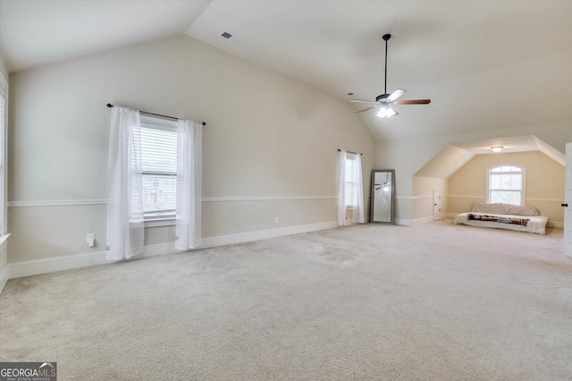 bonus room with ceiling fan, lofted ceiling, and light carpet